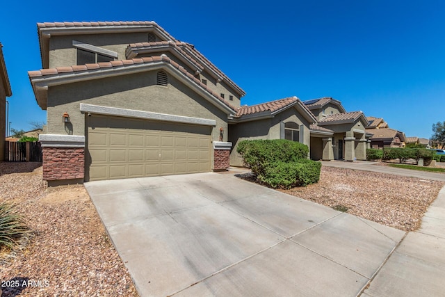 23848 W Grove St, Buckeye, AZ 85326 - mediterranean / spanish-style house with a tile roof, driveway, and stucco siding
