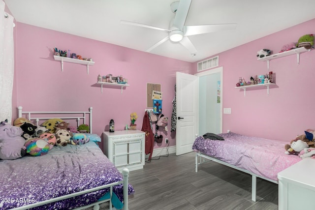 23848 W Grove St, Buckeye, AZ 85326 - bedroom with visible vents, a ceiling fan, and wood finished floors
