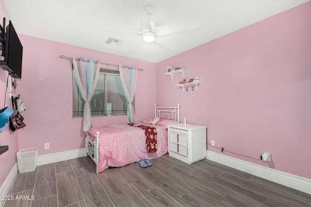 23848 W Grove St, Buckeye, AZ 85326 - bedroom with visible vents, baseboards, and wood finish floors