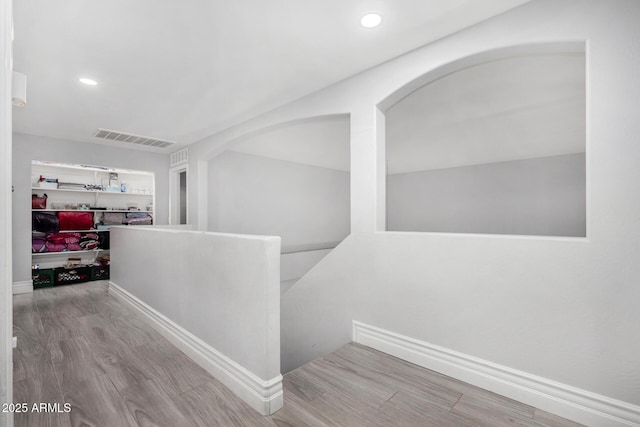 23848 W Grove St, Buckeye, AZ 85326 - hallway with recessed lighting, visible vents, baseboards, and wood finished floors