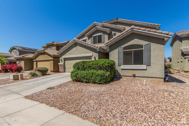 23848 W Grove St, Buckeye, AZ 85326 - mediterranean / spanish-style house with a tiled roof, an attached garage, driveway, and stucco siding