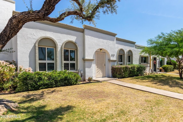 8328 E Chaparral Rd, Scottsdale, AZ 85250 - mediterranean / spanish house with a front yard and stucco siding