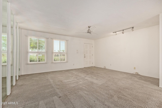 8328 E Chaparral Rd, Scottsdale, AZ 85250 - carpeted empty room with ceiling fan and track lighting