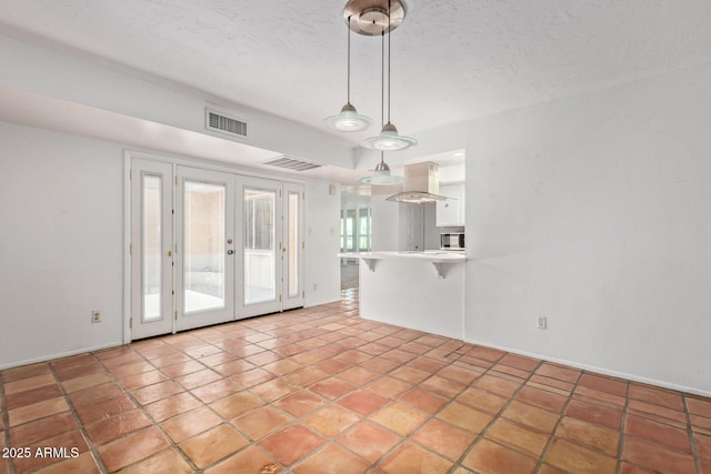 8328 E Chaparral Rd, Scottsdale, AZ 85250 - unfurnished living room with french doors and a textured ceiling