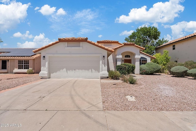 732 W Sagebrush St, Gilbert, AZ 85233 - mediterranean / spanish-style house featuring a garage, stucco siding, a tile roof, and concrete driveway