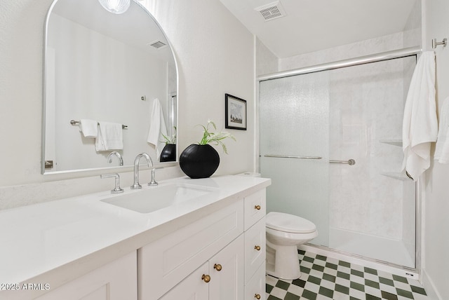 732 W Sagebrush St, Gilbert, AZ 85233 - bathroom featuring vanity, tile patterned floors, a stall shower, and toilet