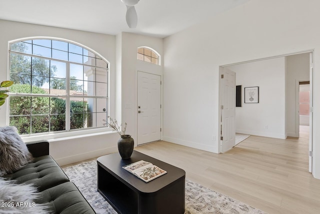 732 W Sagebrush St, Gilbert, AZ 85233 - living room featuring plenty of natural light, light wood-style floors, and baseboards