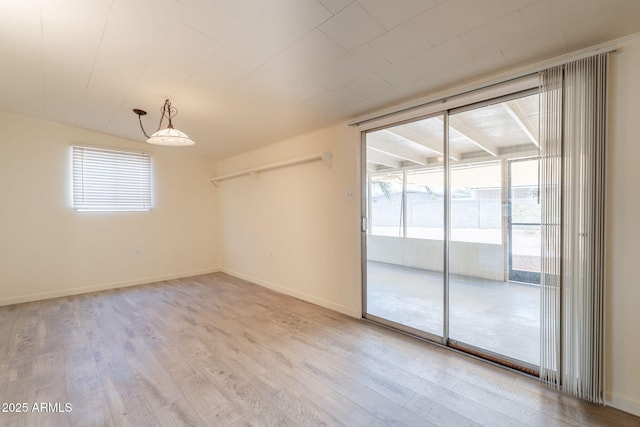 1124 S Longwood Loop, Mesa, AZ 85208 - unfurnished room featuring healthy amount of natural light and light wood-style flooring