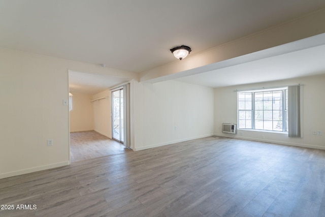 1124 S Longwood Loop, Mesa, AZ 85208 - unfurnished room featuring wood finished floors and a wall unit AC