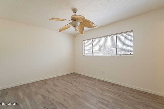 1124 S Longwood Loop, Mesa, AZ 85208 - unfurnished room featuring wood finished floors, a ceiling fan, and a textured ceiling