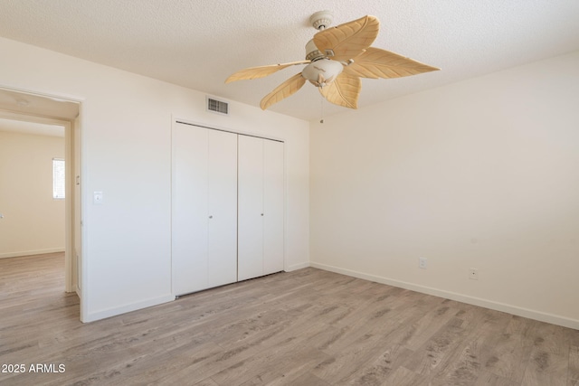 1124 S Longwood Loop, Mesa, AZ 85208 - unfurnished bedroom featuring light wood finished floors, a closet, and ceiling fan