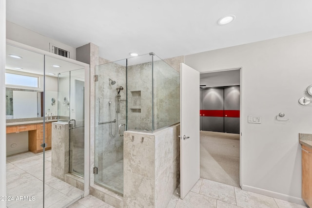 7385 E Pleasant Run, Scottsdale, AZ 85258 - bathroom with vanity, a stall shower, tile patterned floors, and recessed lighting