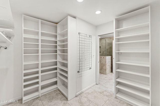 7385 E Pleasant Run, Scottsdale, AZ 85258 - walk in closet with tile patterned floors
