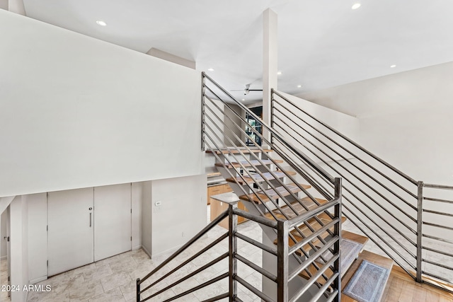 7385 E Pleasant Run, Scottsdale, AZ 85258 - stairway featuring recessed lighting and ceiling fan