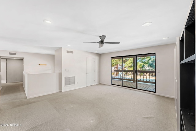 7385 E Pleasant Run, Scottsdale, AZ 85258 - unfurnished living room featuring light carpet, ceiling fan, and recessed lighting