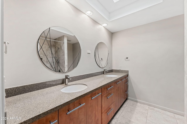 7385 E Pleasant Run, Scottsdale, AZ 85258 - full bathroom with double vanity, a tile shower, tile patterned flooring, and recessed lighting