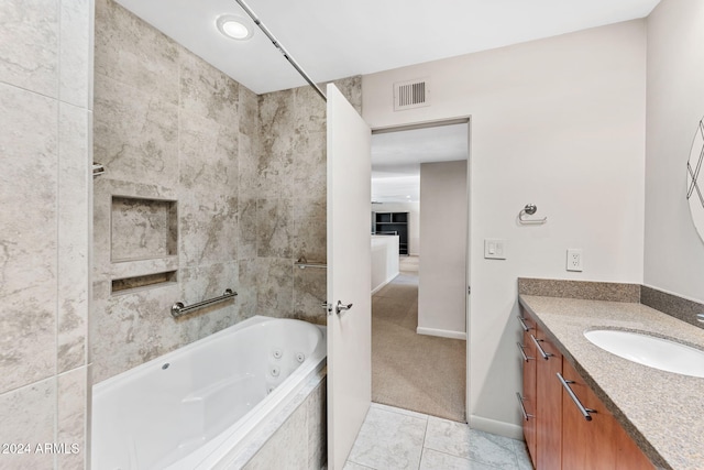 7385 E Pleasant Run, Scottsdale, AZ 85258 - bathroom featuring vanity, a combined bath / shower with jetted tub, and tile patterned flooring