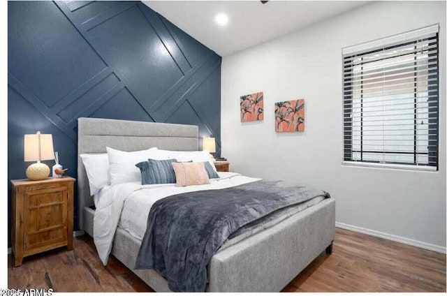 bedroom with hardwood / wood-style flooring