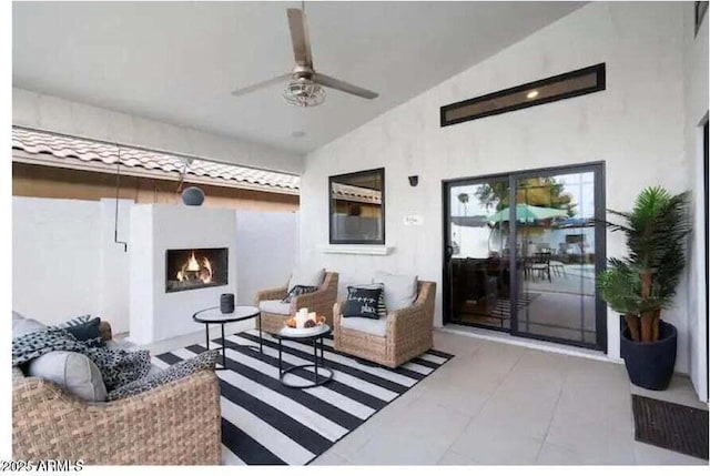 living room with ceiling fan and lofted ceiling