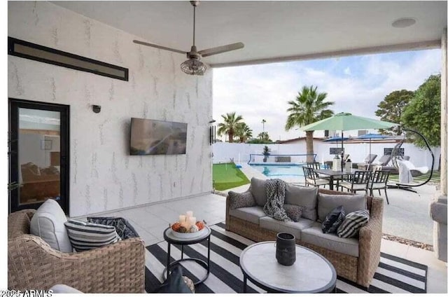 view of patio / terrace featuring an outdoor living space, ceiling fan, and a fenced in pool