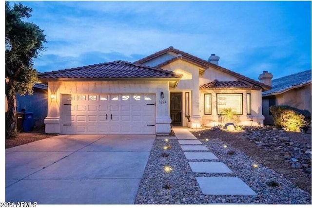 view of front of property with a garage