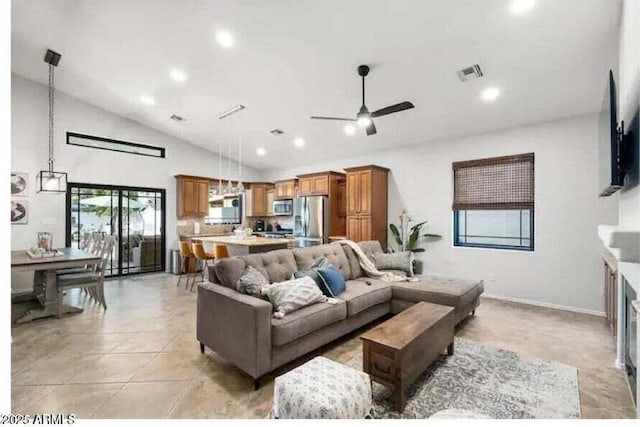 living room featuring vaulted ceiling and ceiling fan