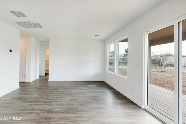 spare room featuring dark hardwood / wood-style flooring