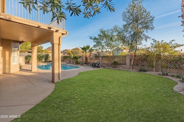 view of yard with a patio area and a fenced in pool