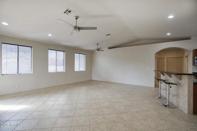 unfurnished living room featuring recessed lighting, visible vents, plenty of natural light, and ceiling fan