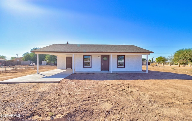 single story home with fence, roof with shingles, and stucco siding