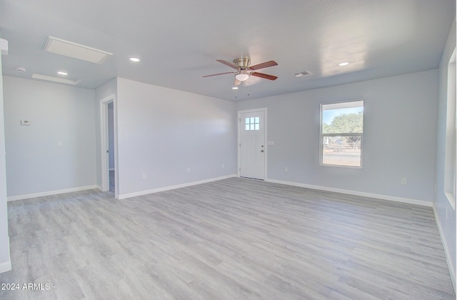 empty room with visible vents, baseboards, recessed lighting, light wood-style flooring, and a ceiling fan