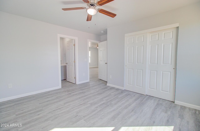 unfurnished bedroom featuring baseboards, light wood-type flooring, a closet, and ceiling fan