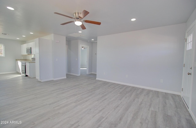 unfurnished living room with recessed lighting, light wood-style floors, baseboards, and ceiling fan