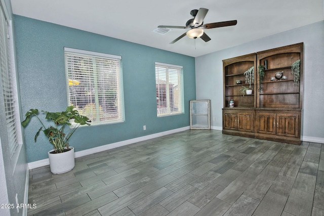 927 N Somerset Cir, Mesa, AZ 85205 - spare room featuring a ceiling fan and wood finished floors