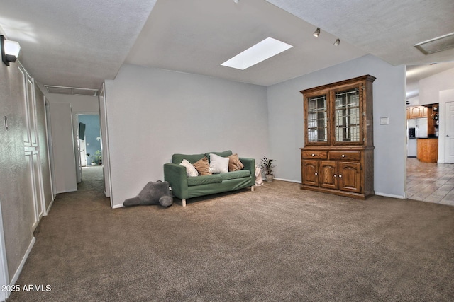 927 N Somerset Cir, Mesa, AZ 85205 - living area featuring carpet, attic access, and a skylight