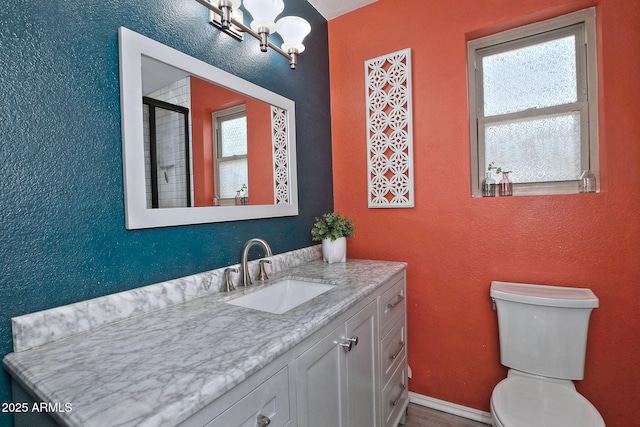 927 N Somerset Cir, Mesa, AZ 85205 - bathroom featuring vanity, a shower with shower door, a textured wall, and a chandelier