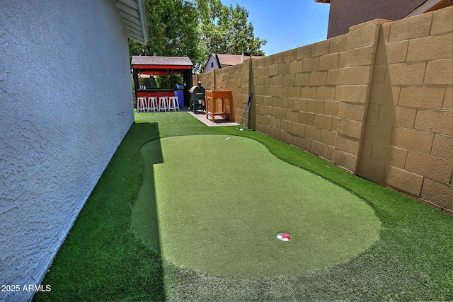 927 N Somerset Cir, Mesa, AZ 85205 - view of yard with a putting green and a gazebo