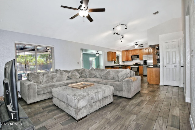 927 N Somerset Cir, Mesa, AZ 85205 - living area featuring ceiling fan, dark wood-style flooring, track lighting, and lofted ceiling