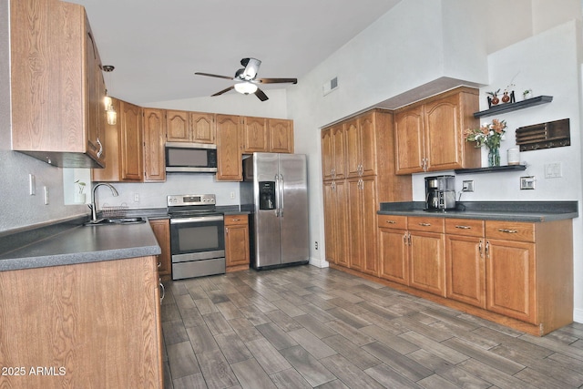 927 N Somerset Cir, Mesa, AZ 85205 - kitchen with stainless steel appliances, a ceiling fan, open shelves, dark countertops, and wood finish floors