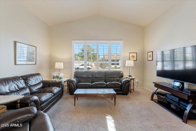 carpeted living area featuring vaulted ceiling