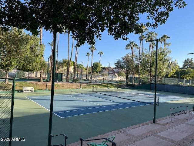 view of sport court featuring fence