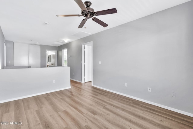 spare room featuring ceiling fan and light hardwood / wood-style floors