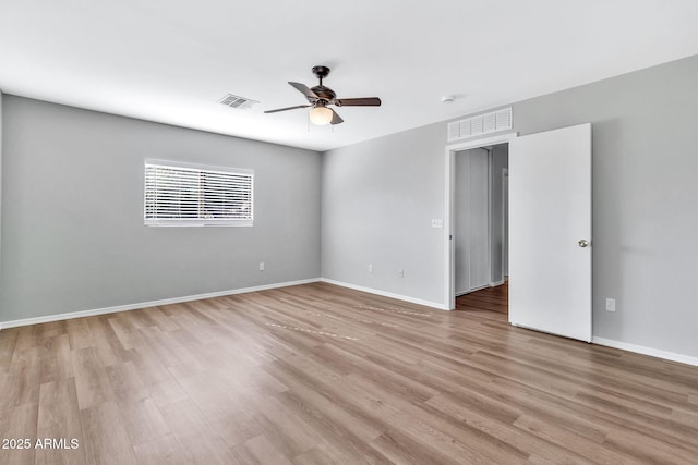 unfurnished room featuring light hardwood / wood-style floors and ceiling fan