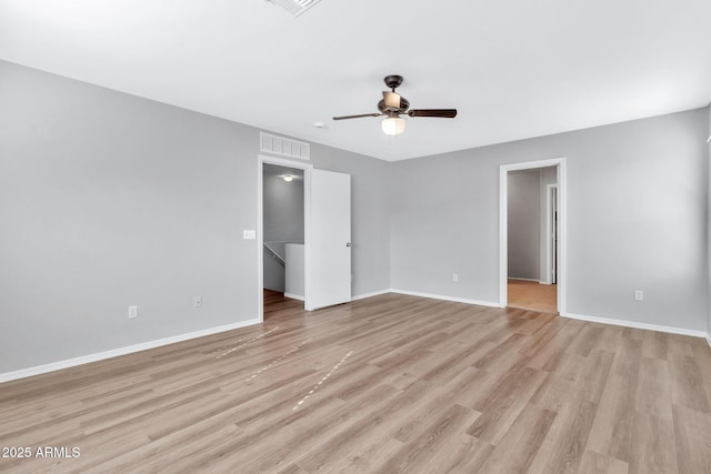 spare room with ceiling fan and light hardwood / wood-style floors