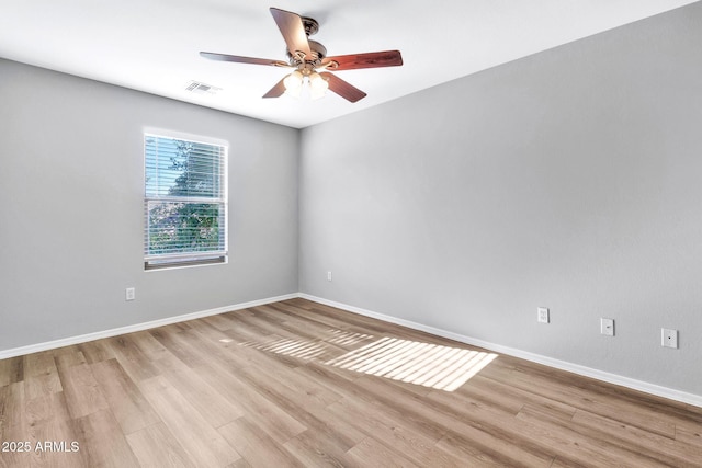 spare room featuring ceiling fan and light wood-type flooring