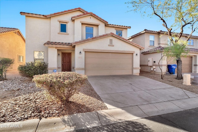 mediterranean / spanish-style house with a garage