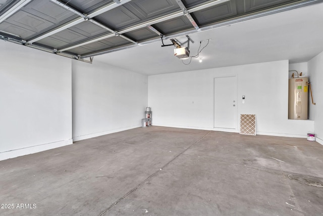 garage featuring water heater and a garage door opener