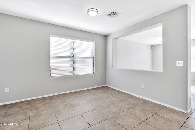 view of tiled spare room