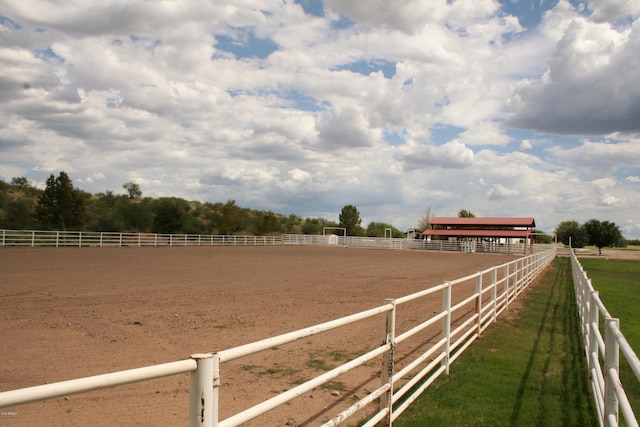 view of yard with a rural view