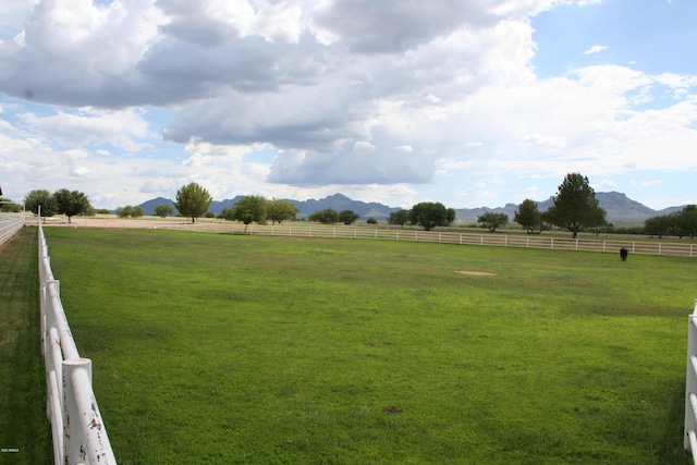 view of yard featuring a mountain view and a rural view